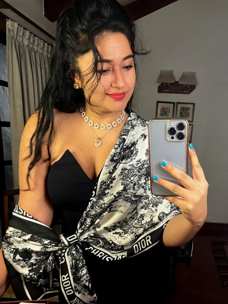 Poonam Bajwa Stuns in Strapless Blouse and Black Saree Combo